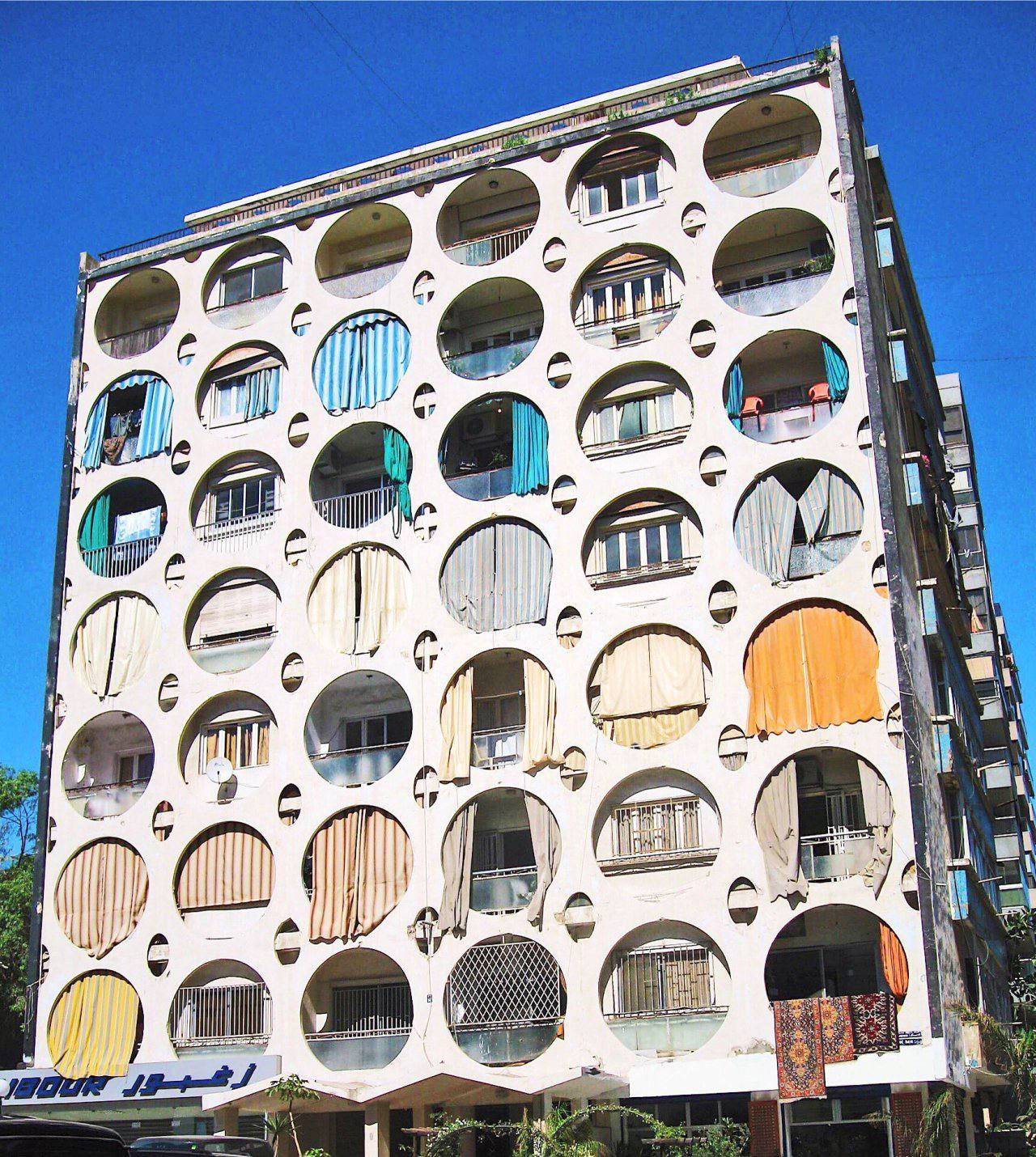Perforated Residential Facade with Textile Infill